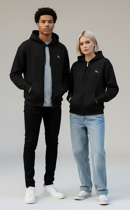 Young man and woman wearing black hooded zip-up sweatshirts with small logo, casual jeans and sneakers